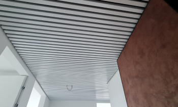 Cube-shaped rail ceilings KRAFT in a prestigious residential complex in Romania (before and after photos)